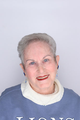 Jan Martinez smiles at the camera while wearing a UAFS sweatshirt and dress shirt.