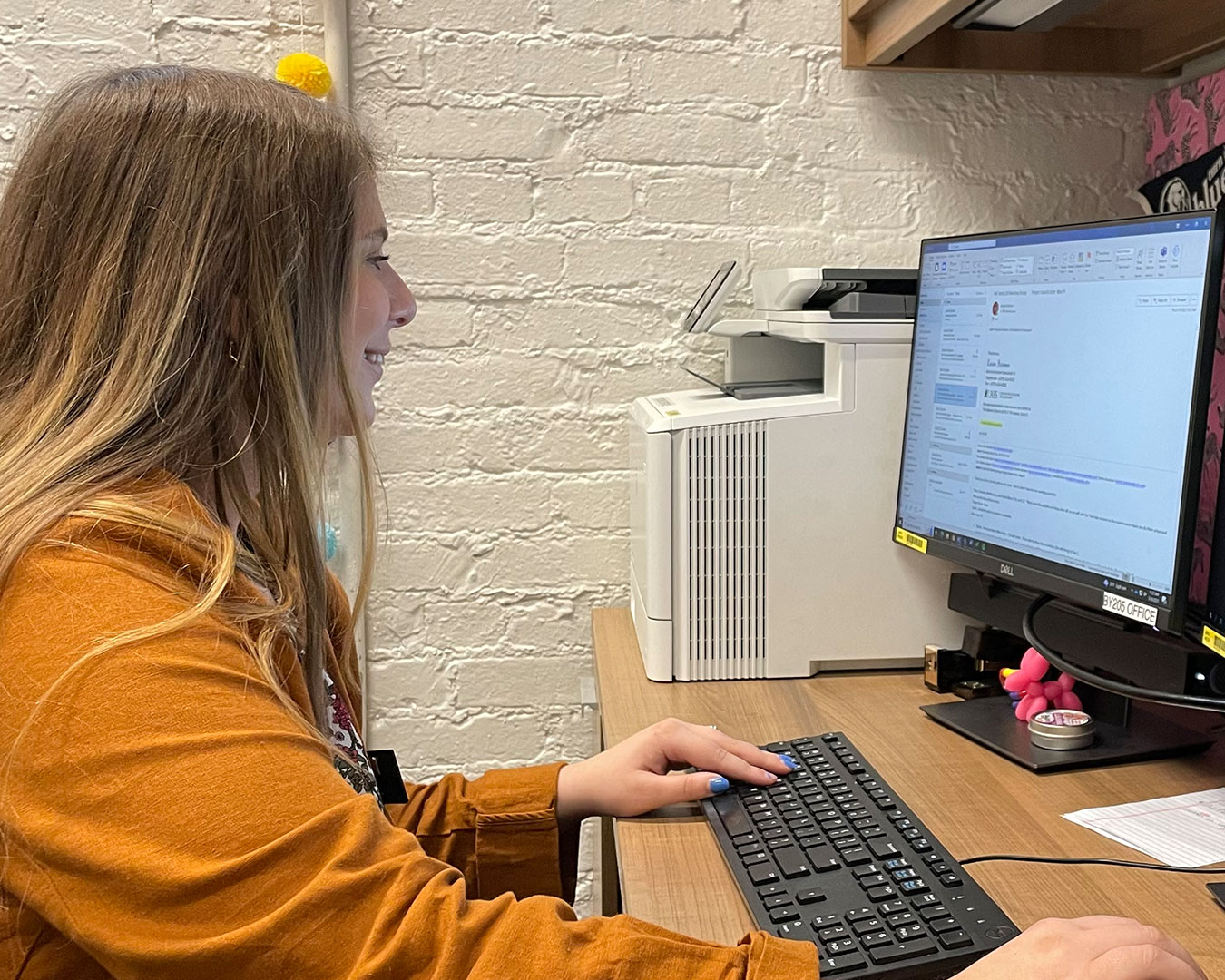 Chelsea Cowan checks her email for the latest event at the CED