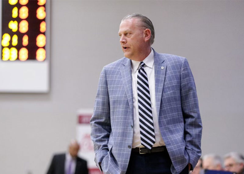 UAFS Athletic Director Curtis Janz walks along the sidelines during a game