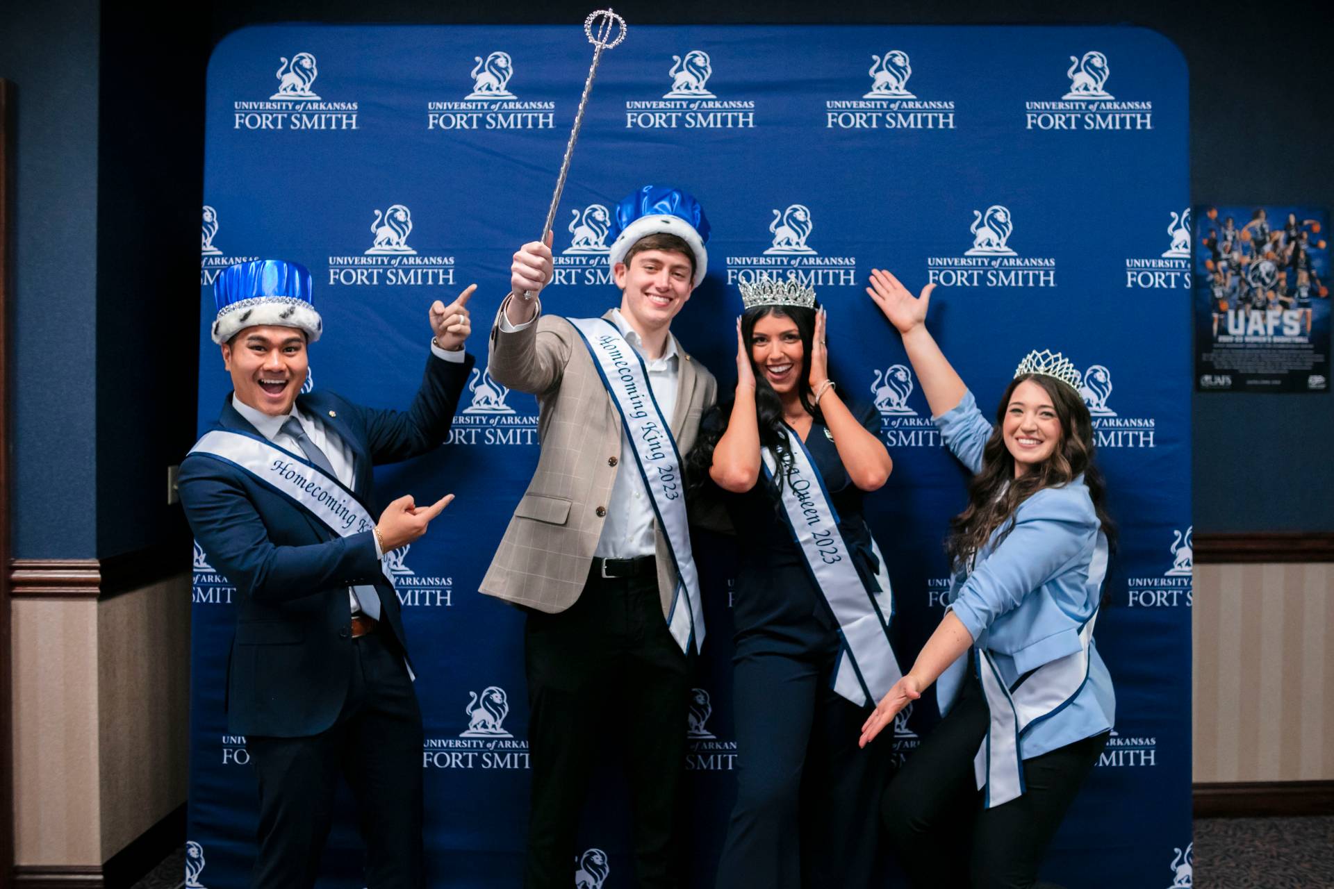 Four students in crowns celebrate homecoming