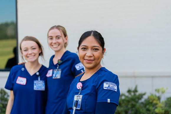 three nursing students standing outside