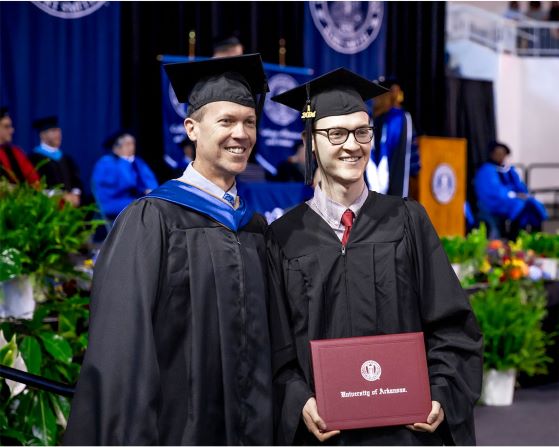 Two men in graduation regalia