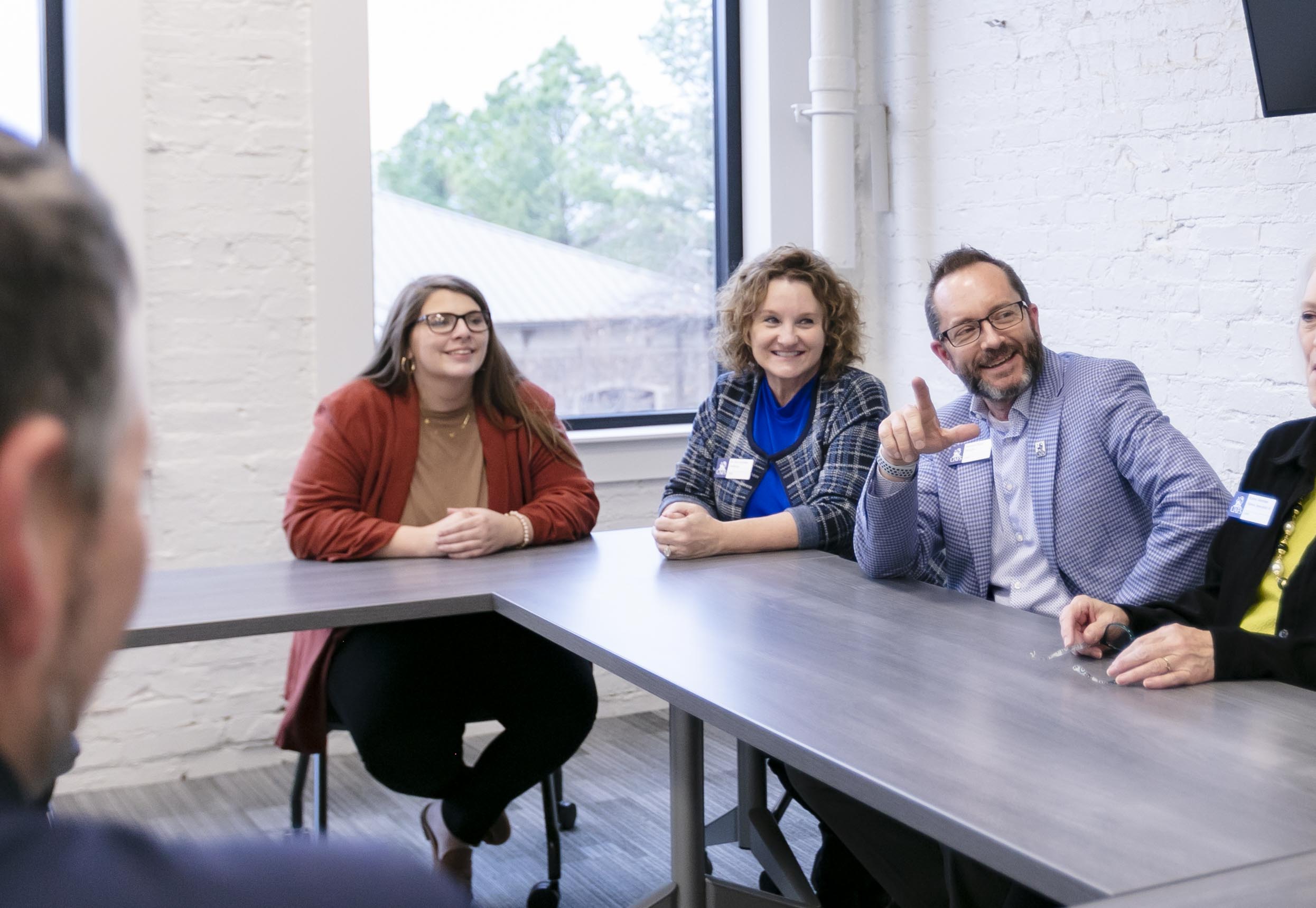 CBPD staff chat around a table 