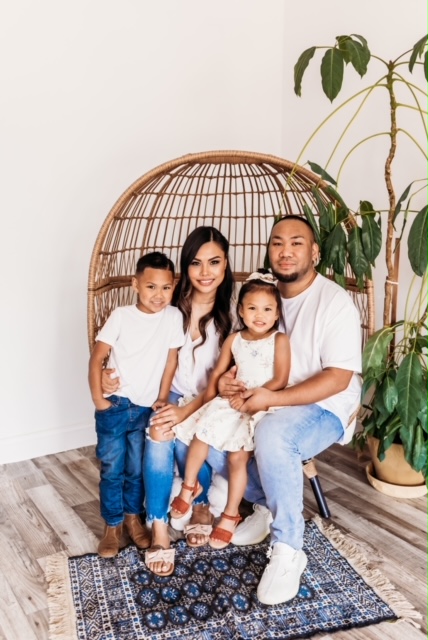 The Sounyaphong family poses for a photo