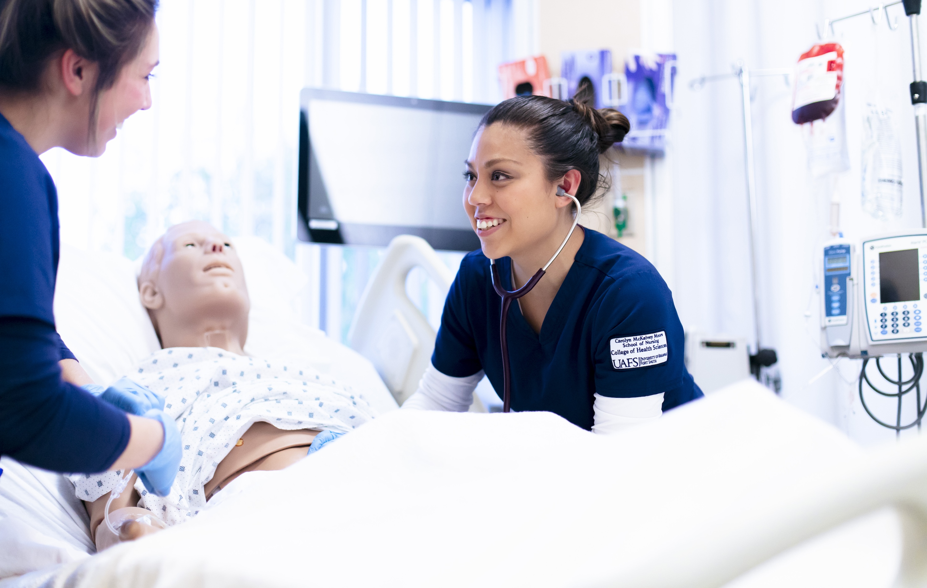 Future nurses work on a high fidelity simulation at UAFS