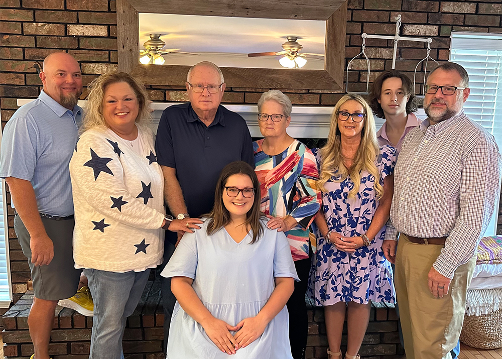 UAFS junior social work student, Anna Capps (center) is surrounded by her aunt and uncle, grandparents, dad, stepmom, and stepbrother. The Capps family was announced as the 2024 UAFS Family of the Year.