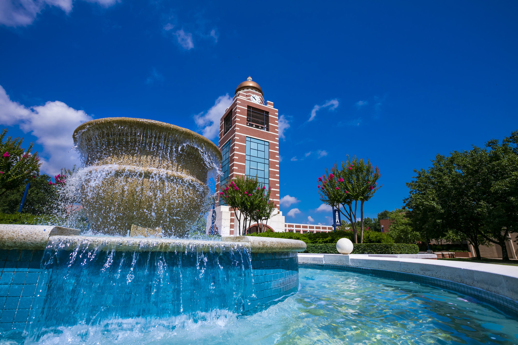 the uafs bell tower in front of a blue sky