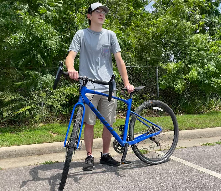 Braxten Martin with the bike he will ride from Seattle, Washington, to Washington, D.C. this summer