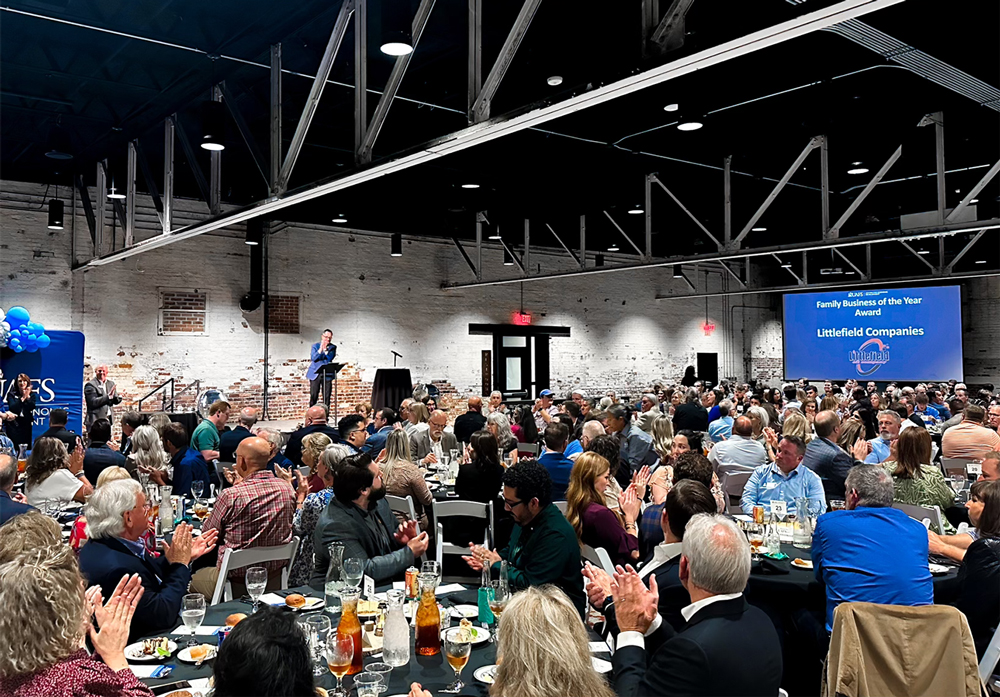 The audience applauds for the winner of the Family Business of the Year Award, Littlefield Companies, at the inaugural Excellence in Family and Small Business Awards