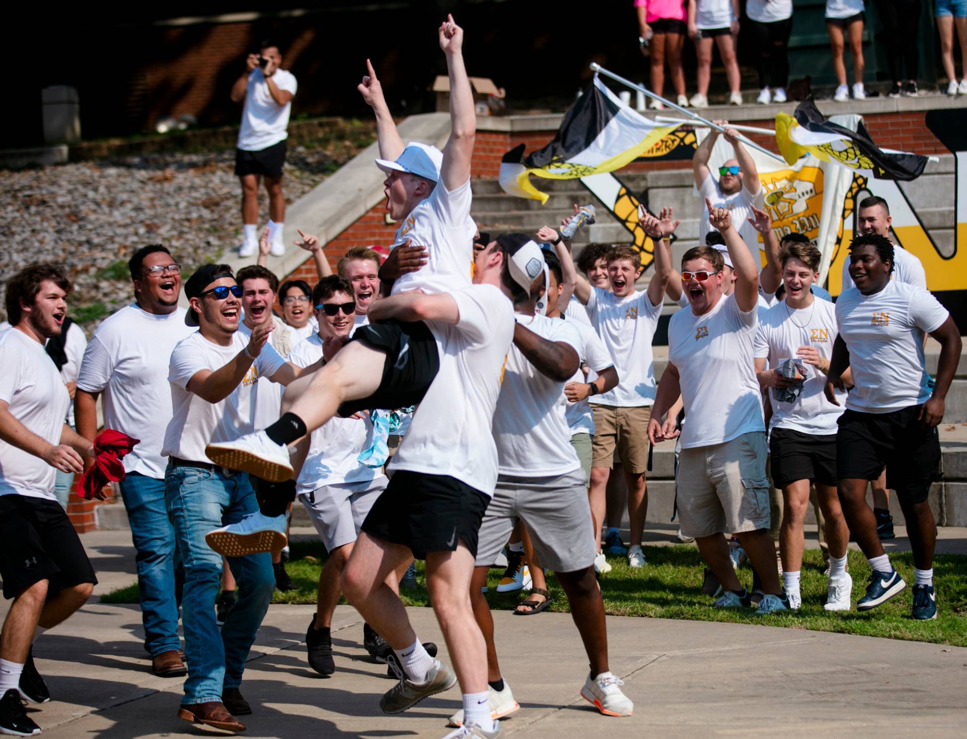 Dylan Newell runs home to his Fraternity, Sigma Nu, at the 2021 Bid Day celebration. 