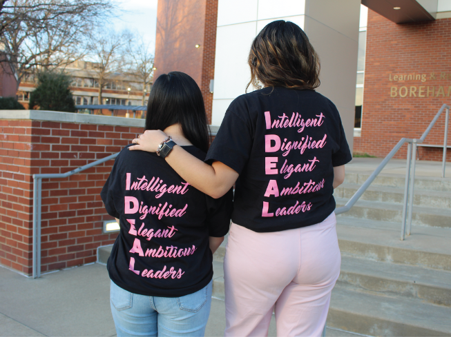 two women in shirts that say Intelligent, Dignified, Elegant, Ambitious, Leaders 