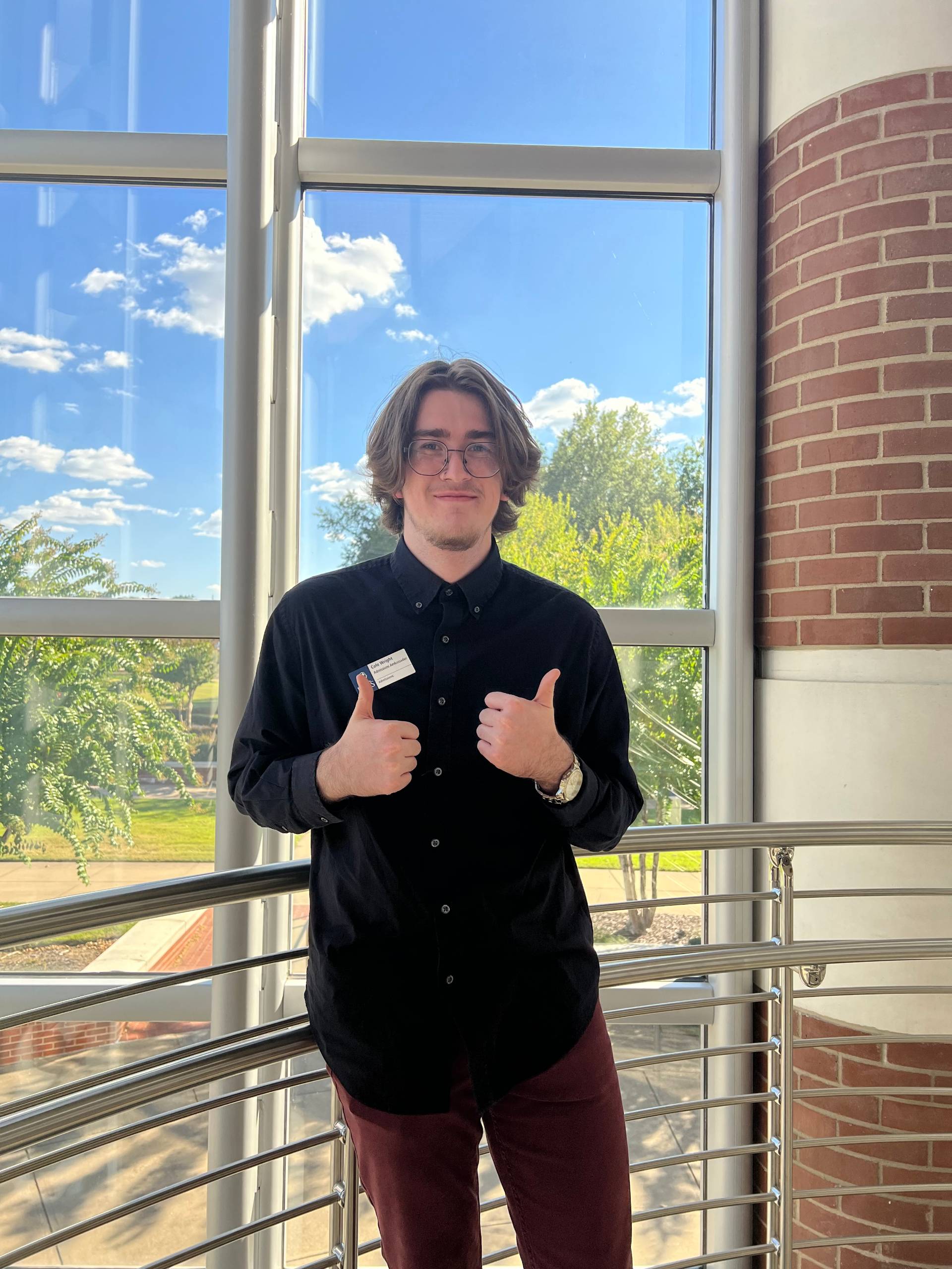 Cole stands in the Campus Center