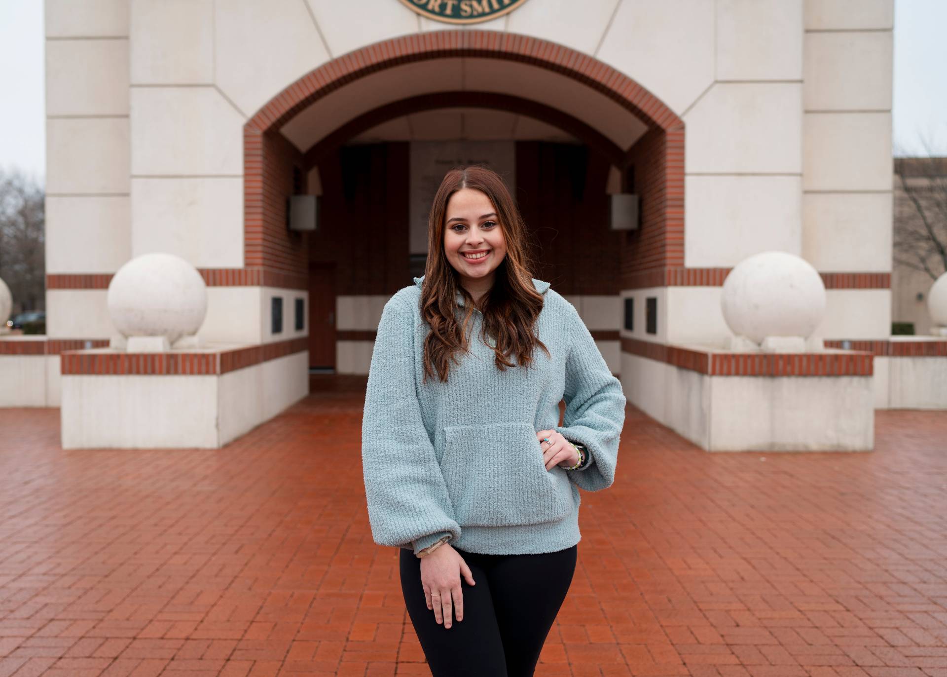 Lena Davis standing in front of the Bell Tower.