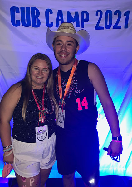 Logan and his now fiance, Alexis Davis, pose for a picture at Cub Camp 2021