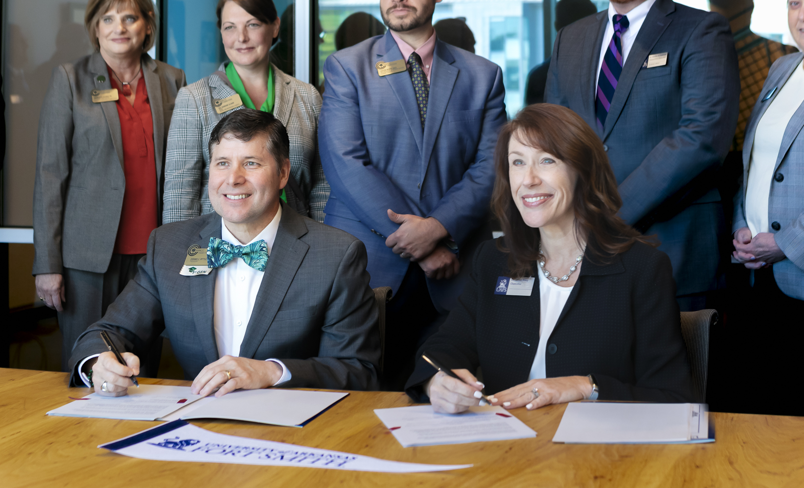 Dr. Rittle and Dr. Riley sign the transfer agreement