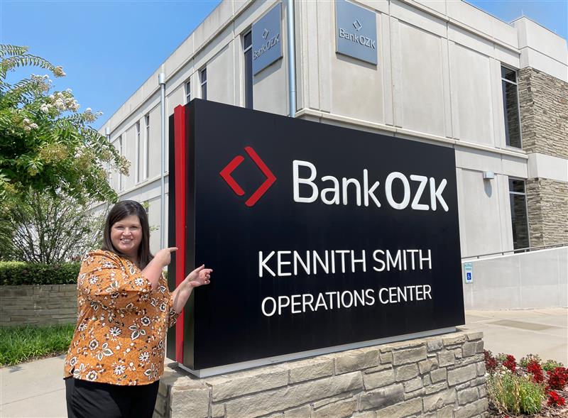 Tracie Walden, managing director for deposit operations, Bank OZK, stands in front of the Ozark, Arkansas, Bank OZK operations center