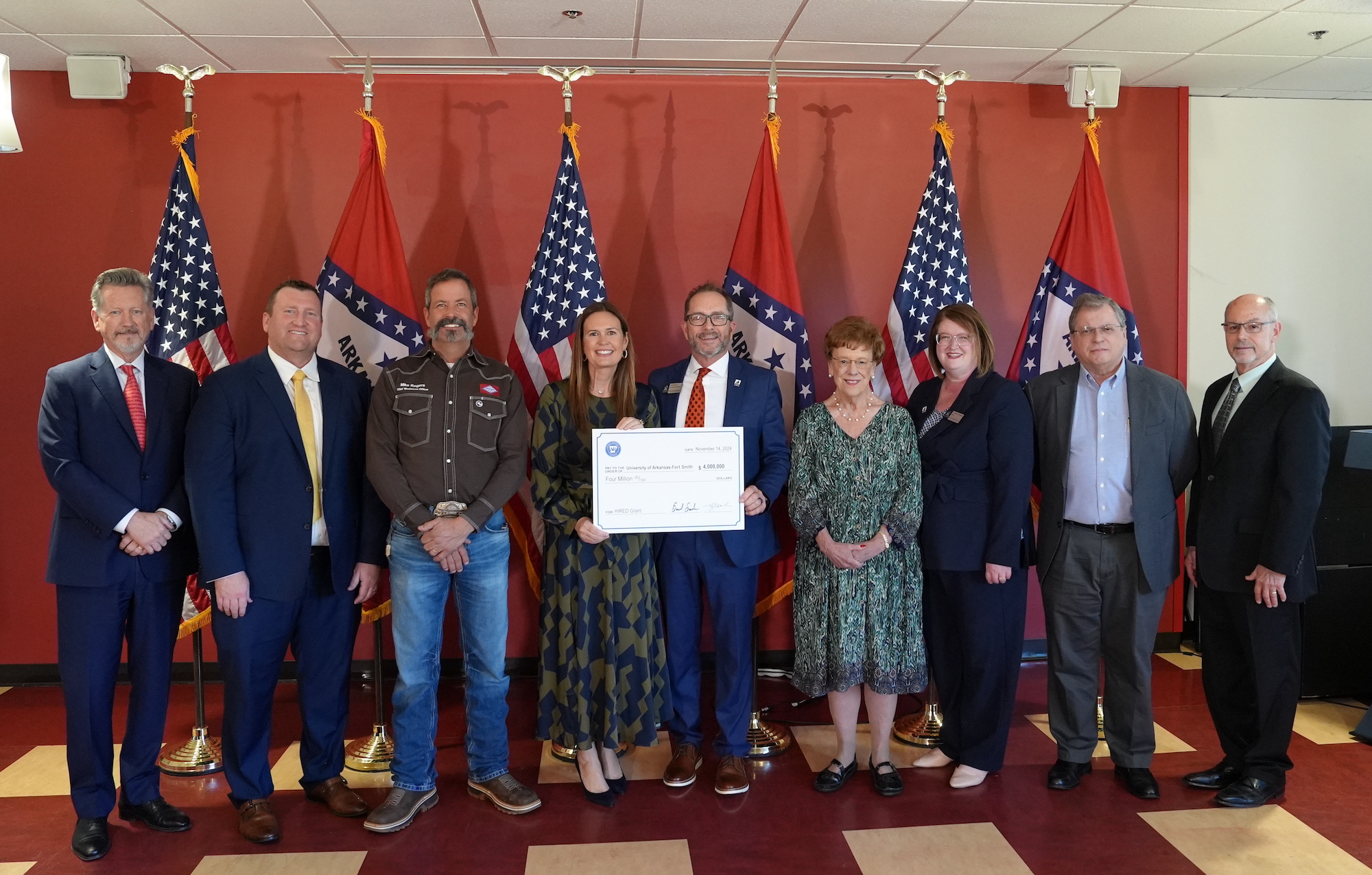 uafs representatives stand wiht arkansas governor sarah huckabee sanders after being awarded a $4m HIRED grant